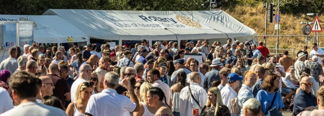 Festival crowd enjoying a summer day event